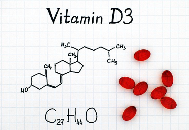 Chemical formula of Vitamin D3 and pills Chemical formula of Vitamin D3 and red pills.