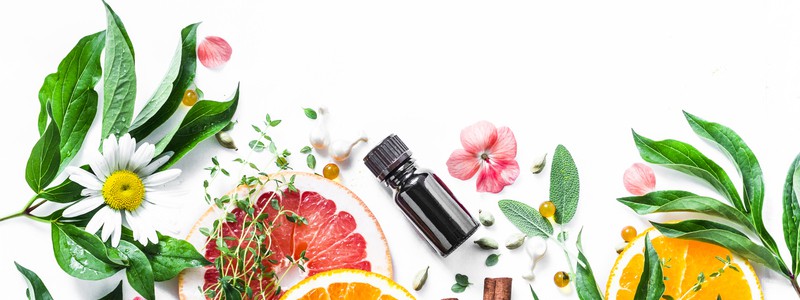 Essential oil for beauty skin. Flat lay beauty ingredients on a Essential oil for beauty skin. Flat lay beauty ingredients on a light background, top view. Beauty healthy lifestyle concept. Copy space