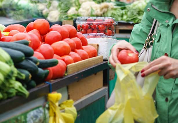 Sales of fresh and organic vegetables and fruits at the green ma Sales of fresh and organic fruits and vegetables at the green market or farmers market. Citizens buyers choose and buy products for healthy food. All for diet healthy eating, lifestyle.