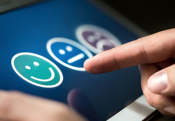Survey, poll or questionnaire for user experience or customer sa Survey, poll or questionnaire for user experience or customer satisfaction research. Quality control and feedback concept. Man choosing his opinion with smiley faces on touch screen.